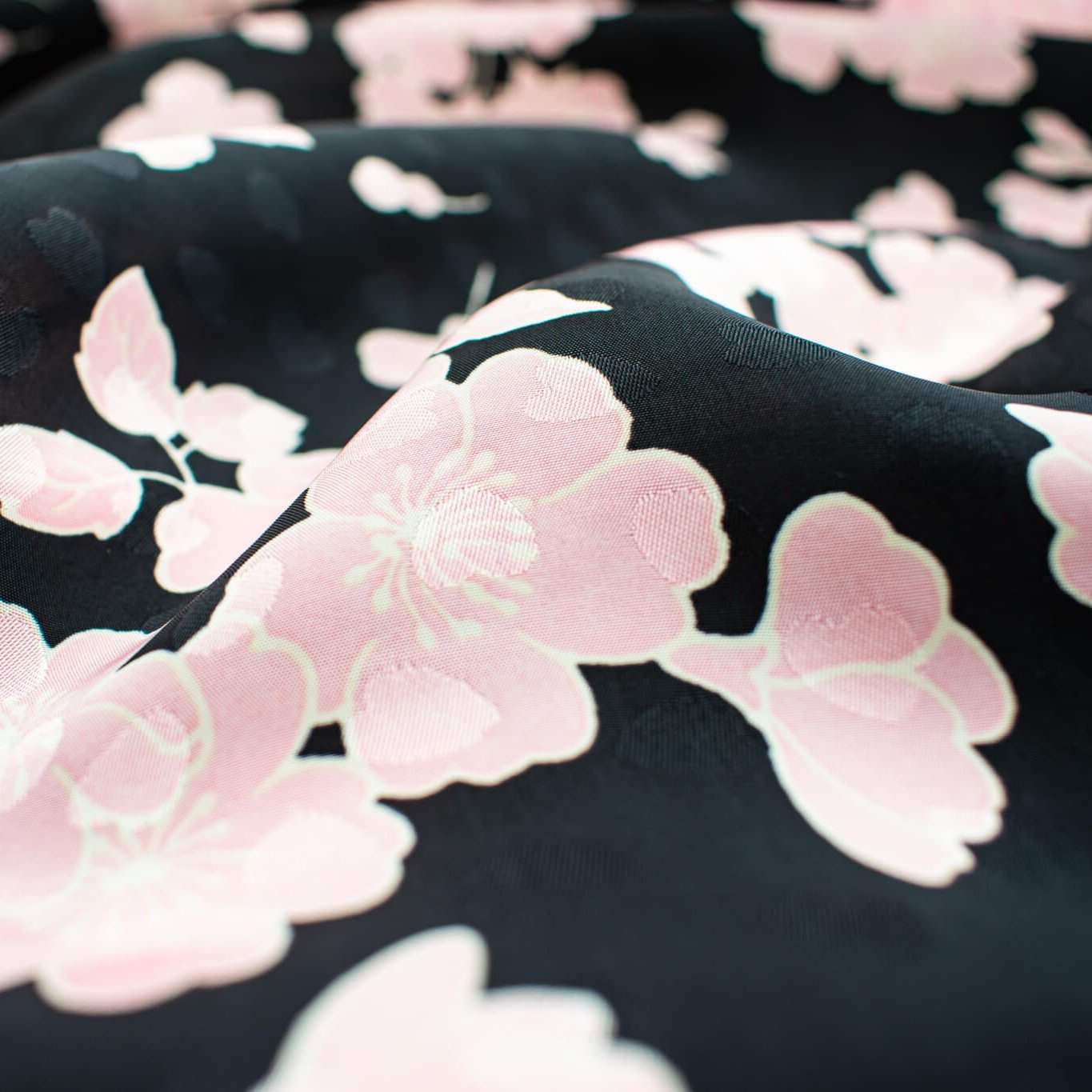  Couture Italian Viscose Floral Jacquard - 'All My Heart'! This stunning designer deadstock fabric by the yard features a gorgeous black base with delicate pink florals and ivory accents. Plus, playful and trending jacquard hearts add a touch of whimsy.&nbsp;

Featuring a nice drape that falls away from the body and slightly textured hand, you'll find this fabric is perfect for formal attire or a little something special.  Close up image of fabric detail to include jacquard pattern.