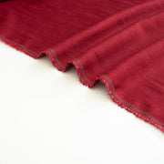 Image of Premium Italian linen-viscose blend in a rich burnt carmine hue. (selvedge)