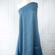 Image of Italian linen and viscose blend woven fabric by the yard in a soft Aegean blue draped on dress form.