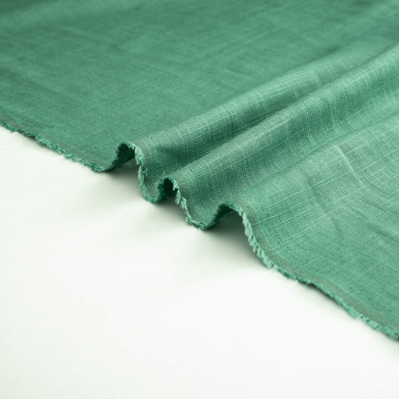 Image of Fine Italian light turquoise linen-viscose blend fabric selvedge.