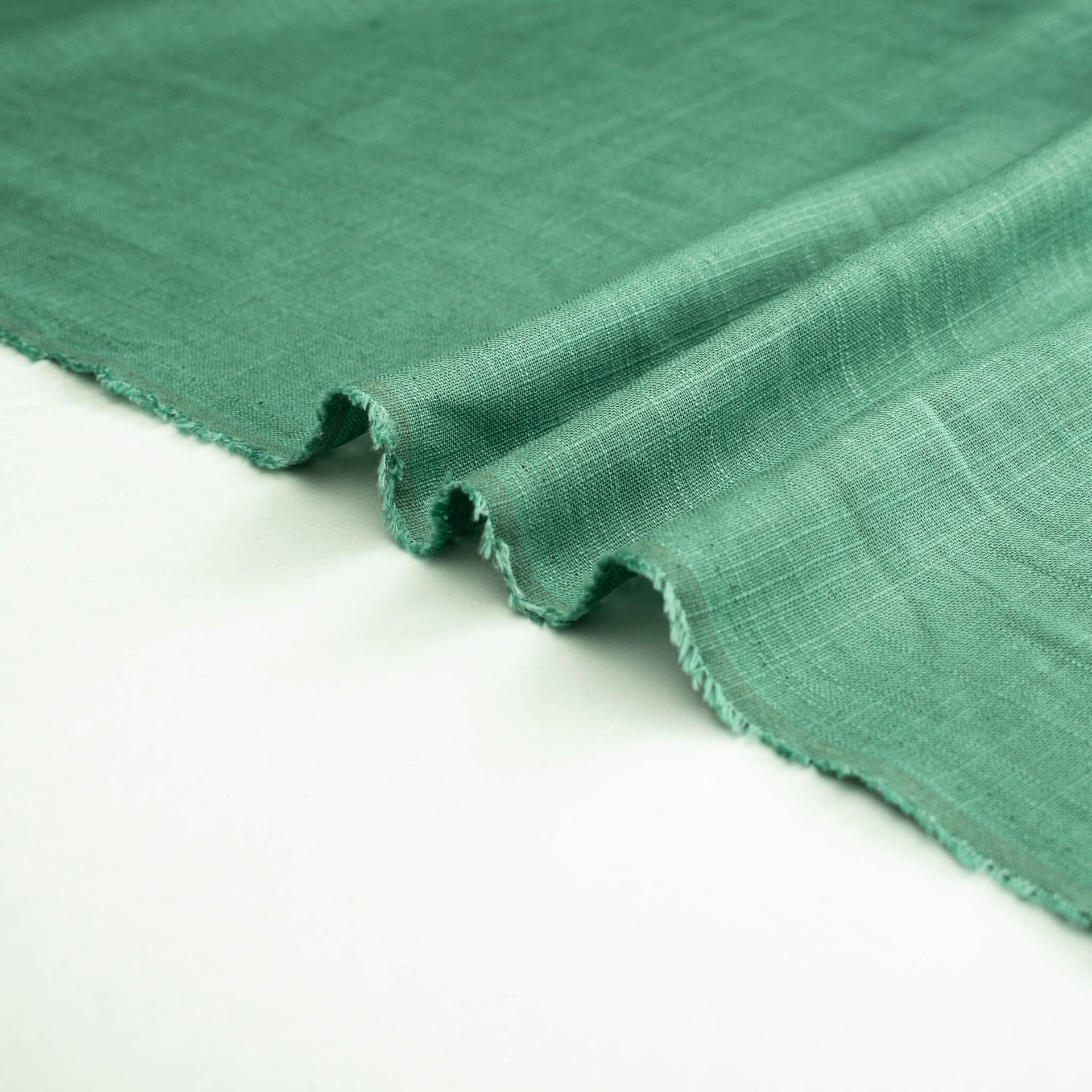 Image of Fine Italian light turquoise linen-viscose blend fabric selvedge.