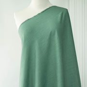 Image of Fine Italian light turquoise linen-viscose blend fabric on dressform.