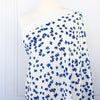 Image of fabric on dressform. Couture, Italian, blue and white floral crepe deadstock fabric by the yard. Sourced from a Los Angeles designer of ready-to-wear and bridal pieces and a favorite among some of Hollywoods A-List stars! 