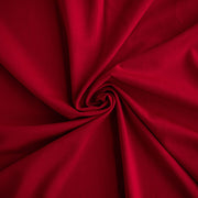 Image of fabric fullness. A gorgeous Red Ponte di Roma double knit fabric by the yard has a soft hand and full bodied drape. You'll love the feel of this Ponte an it is perfect for dresses, jackets and more!