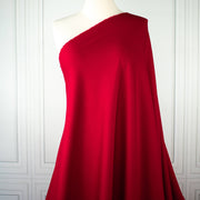 Long image of fabric drape. A gorgeous Red Ponte di Roma double knit fabric by the yard has a soft hand and full bodied drape. You'll love the feel of this Ponte an it is perfect for dresses, jackets and more!