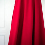 Image of fabric drape. A gorgeous Red Ponte di Roma double knit fabric by the yard has a soft hand and full bodied drape. You'll love the feel of this Ponte an it is perfect for dresses, jackets and more!