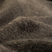 Italian Couture Wool Single Faced designer deadstock knit fabric by the yard in dark taupe and white. Perfect for chilly days this wool knit mimics a fleece with a fuzzy texture on the face and a lightly textured back. Close up image of fabric.