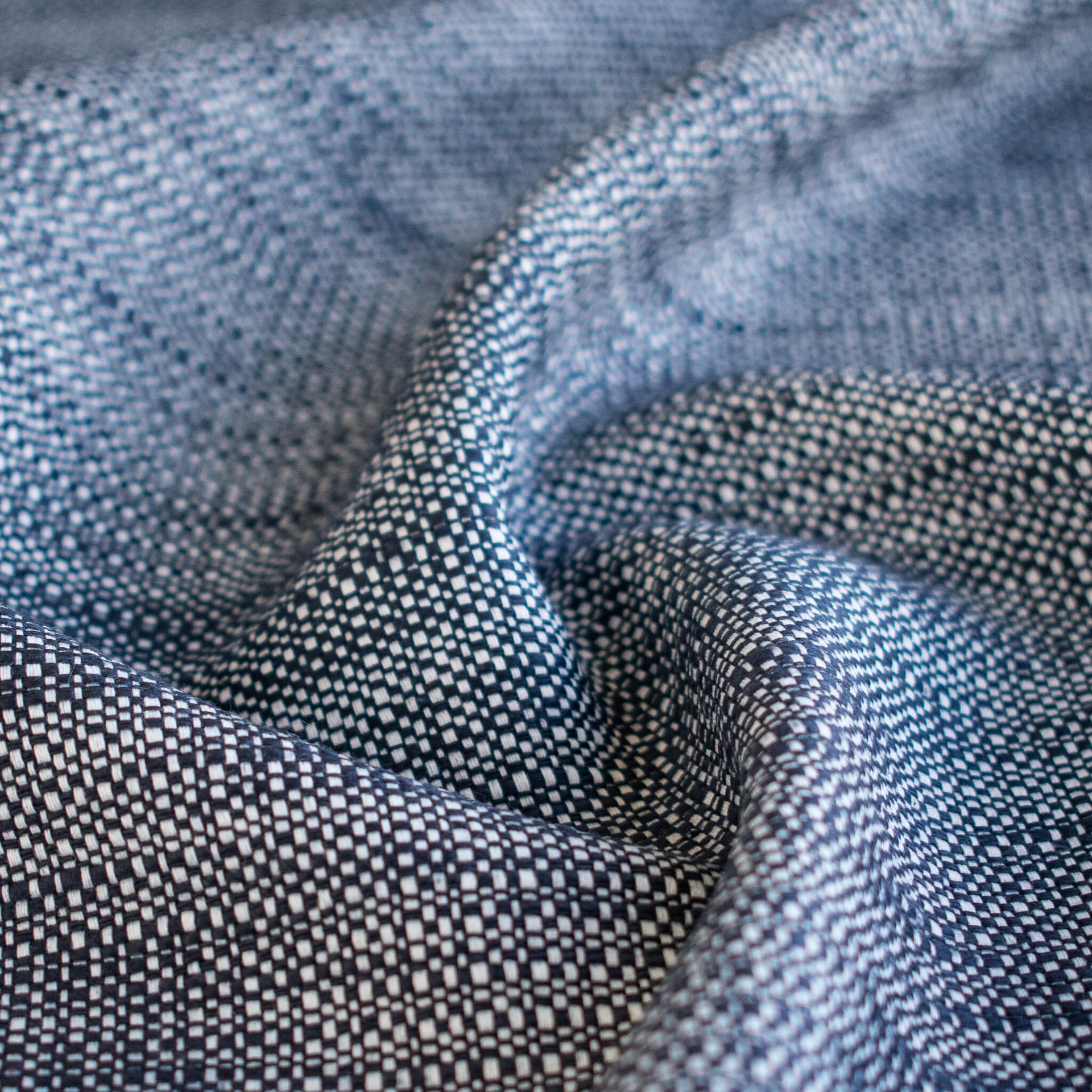 Close-up of blue and white cotton slub fabric.