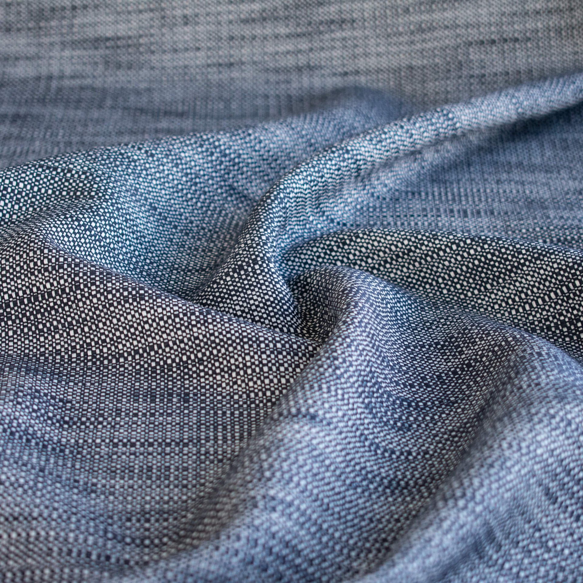 Close-up of blue and white cotton slub fabric.