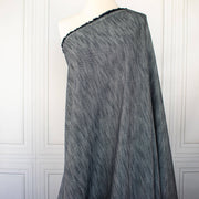 Image  of Couture blue and white cotton slub fabric draped on dress form.