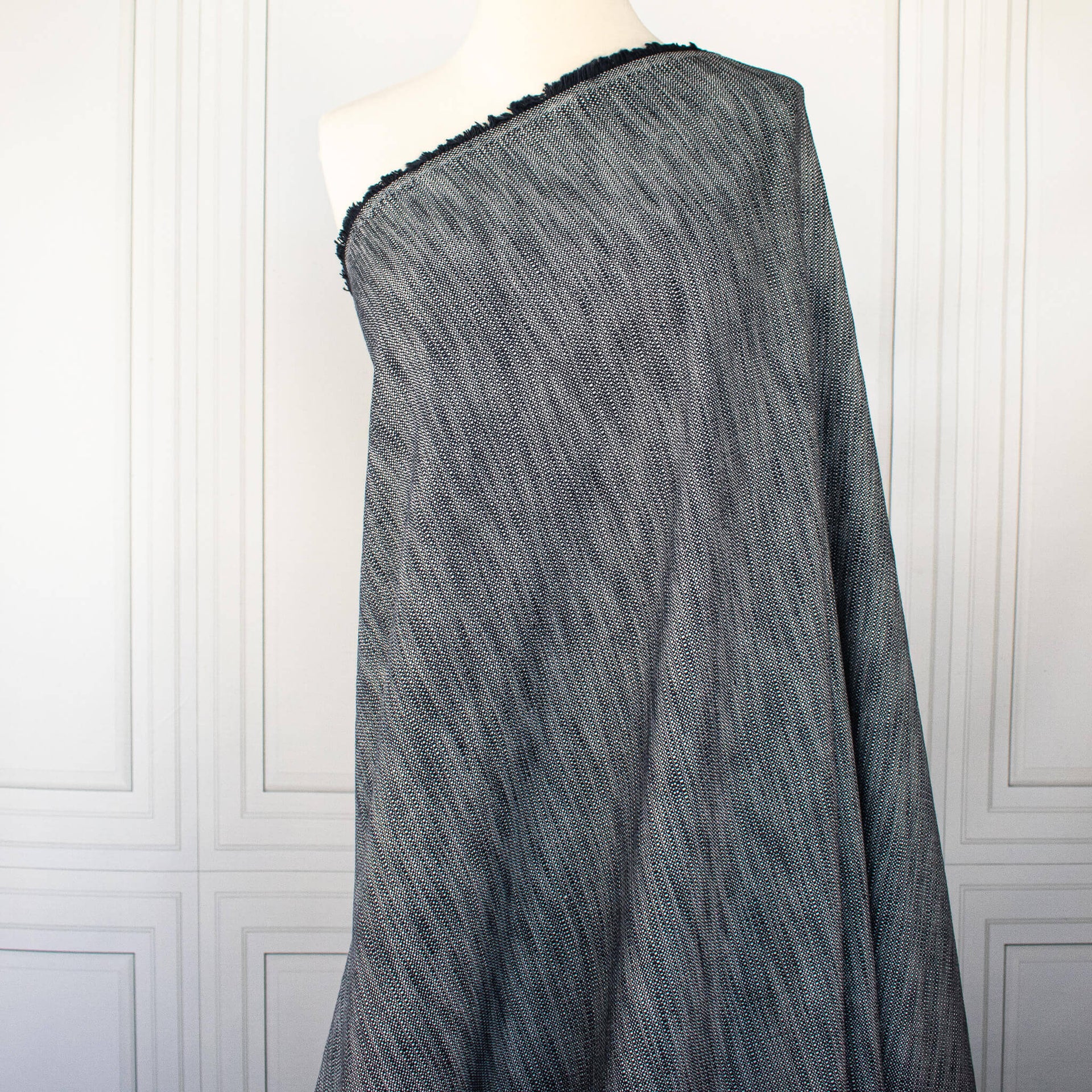 Image  of Couture blue and white cotton slub fabric draped on dress form.