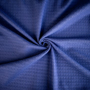Violet  textured couture designer fabric swirled to demonstrate fabric body.