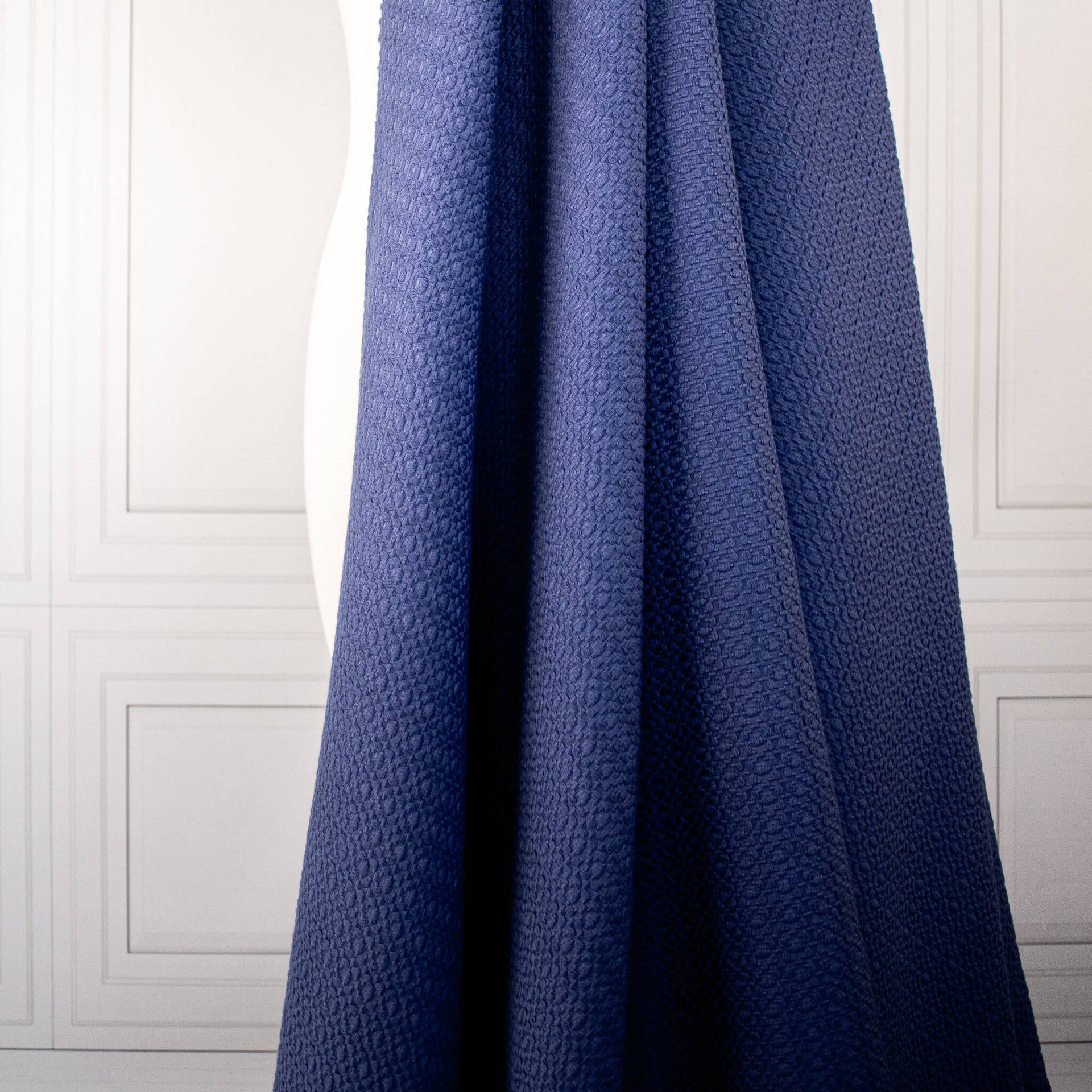 Violet  textured couture designer fabric draped on dressform