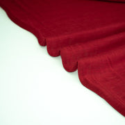  Italian Red Wool Jersey fabric on a white background