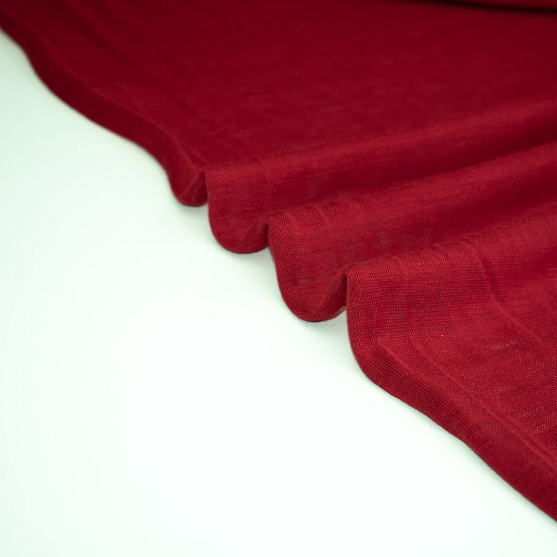  Italian Red Wool Jersey fabric on a white background