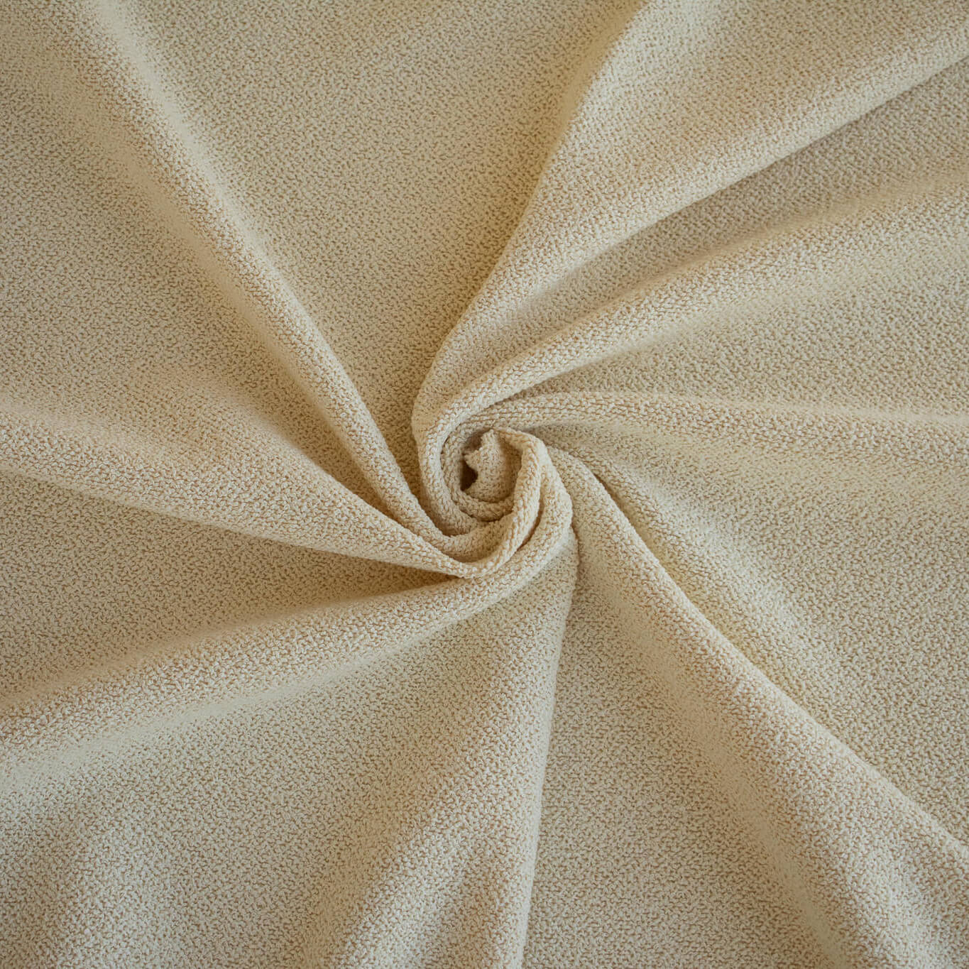 Close-up of Couture Designer Italian Wool Boucle fabric  with a swirl pattern