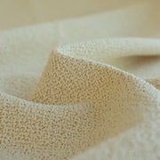 Close-up of Couture Designer Italian Wool Boucle fabric 