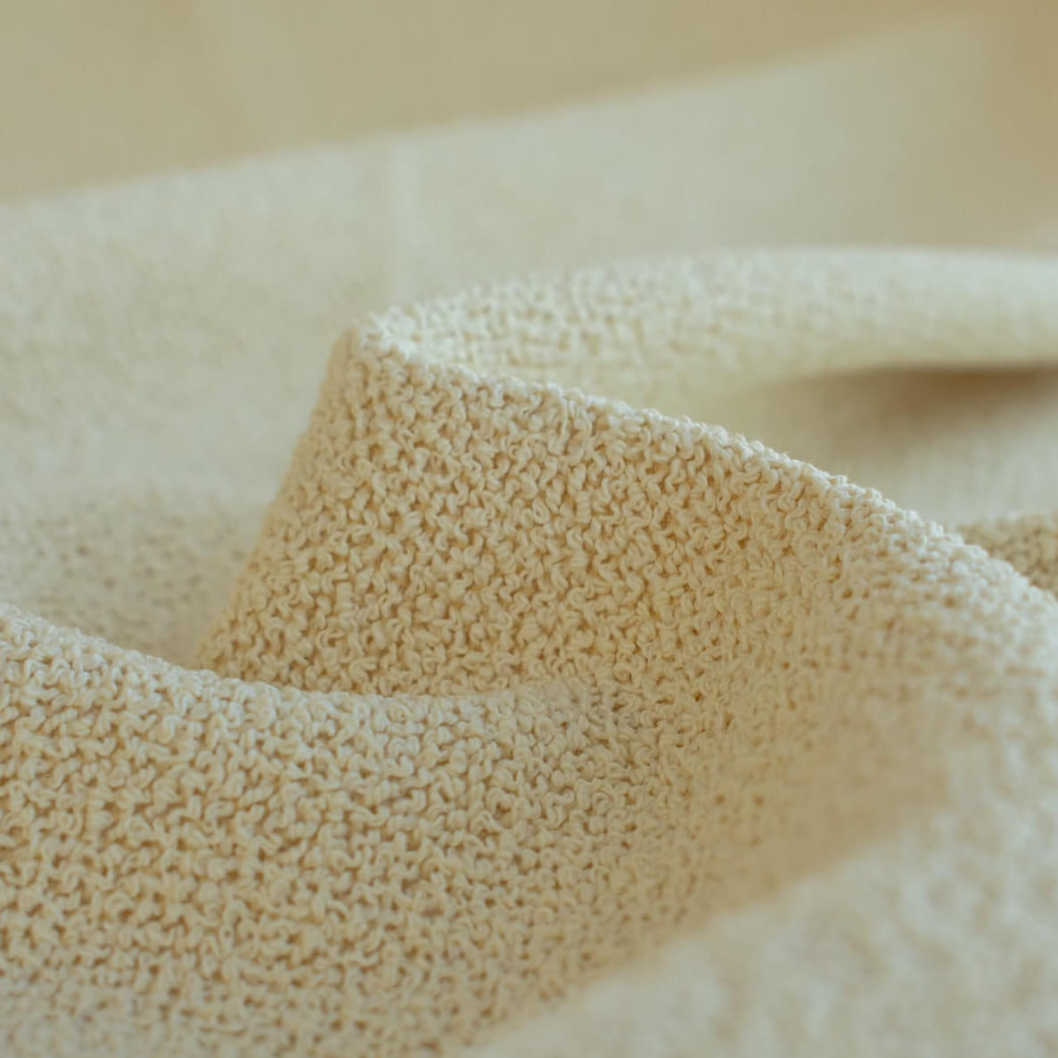 Close-up of Couture Designer Italian Wool Boucle fabric 