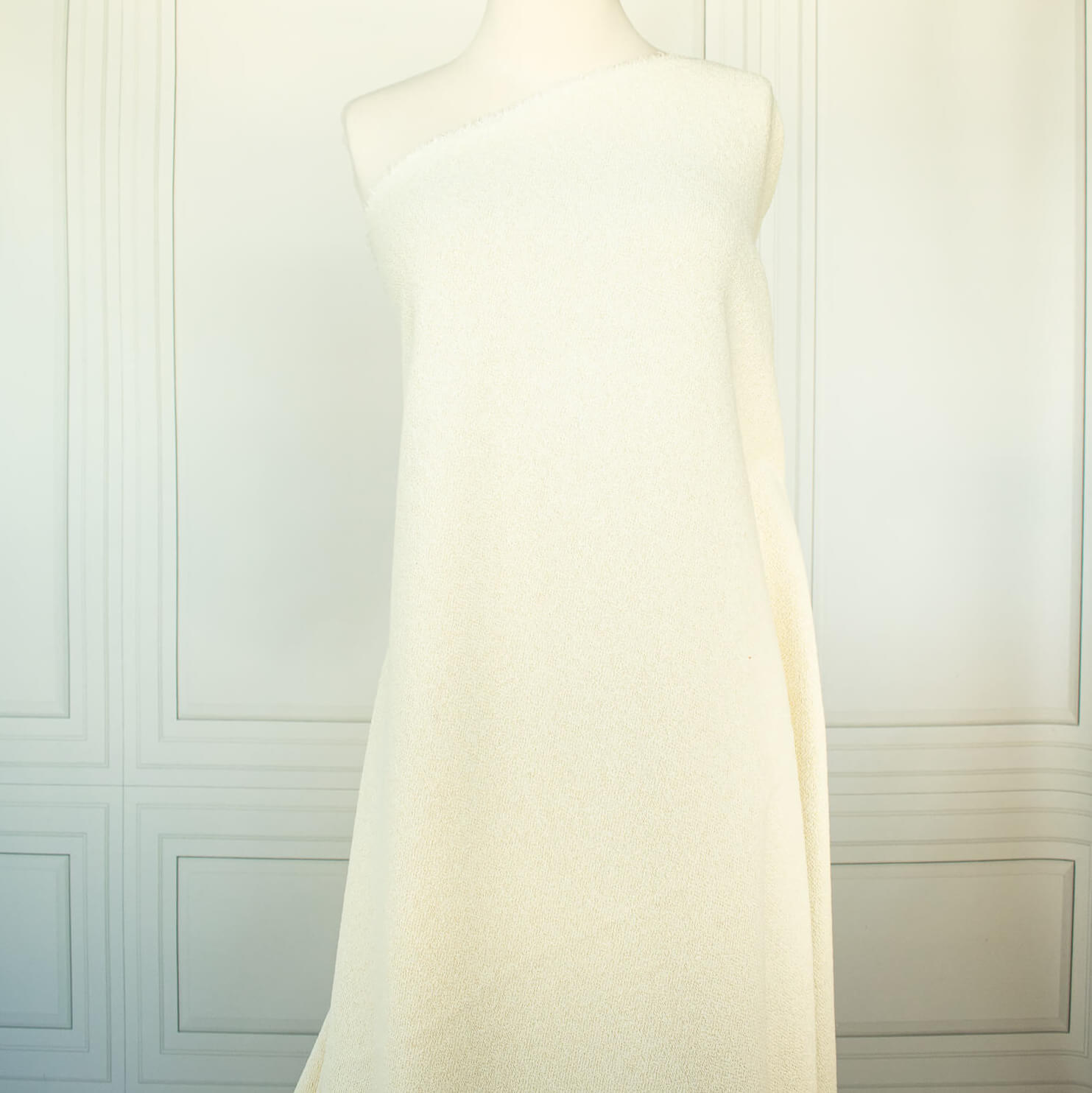 Couture Designer Italian Wool Boucle fabric draped on dressform.
