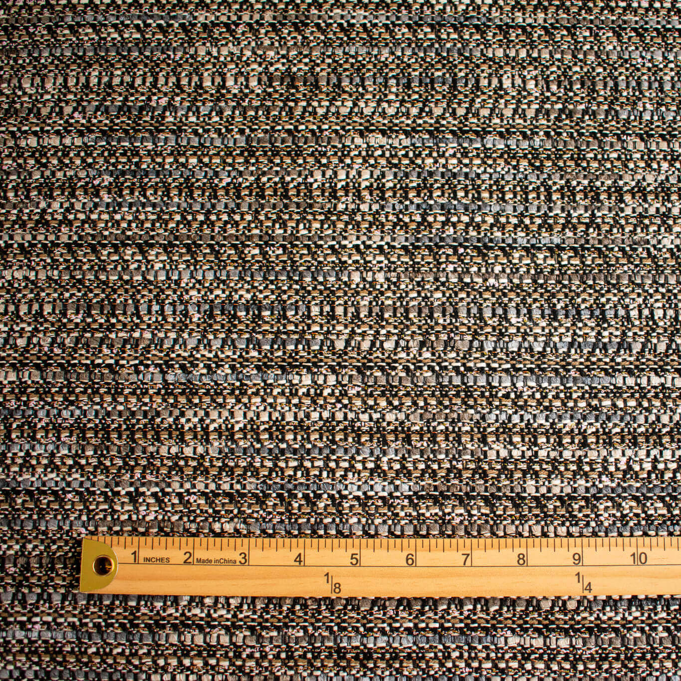 Couture Designer Italian Wool Boucle fabric  with a ruler at the bottom for scale