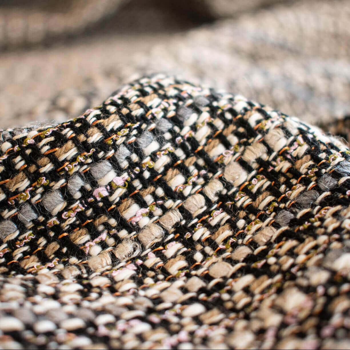 Close-up of Couture Designer Italian Wool Boucle fabric by the yard.