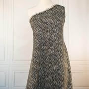 Couture Designer Italian Wool Boucle fabric draped on dressform against a white background.