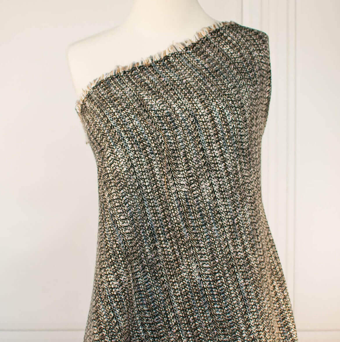 Couture Designer Italian Wool Boucle fabric by the yard against a white background