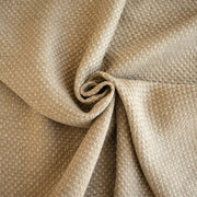 Close-up of Couture Designer Golden Champagne Italian Wool Woven fabric  with a twist..