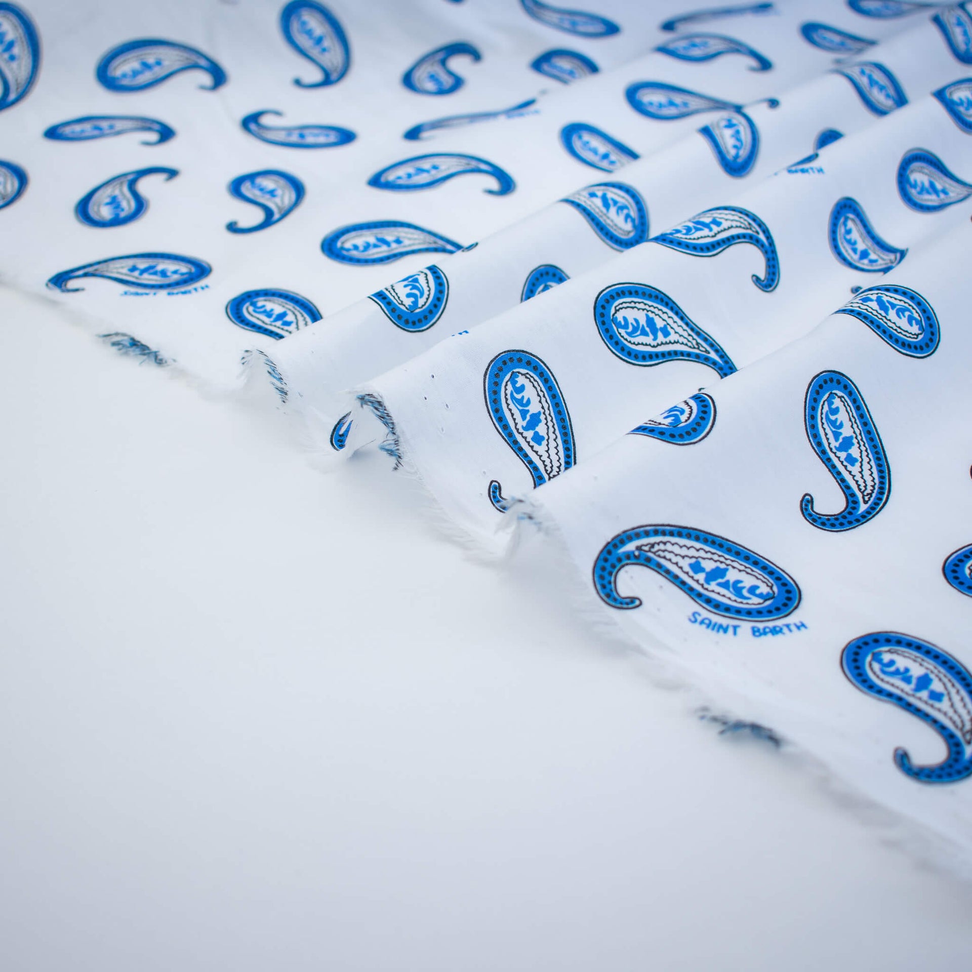 Image of Italian Blue and white paisley print cotton woven fabric selvedge