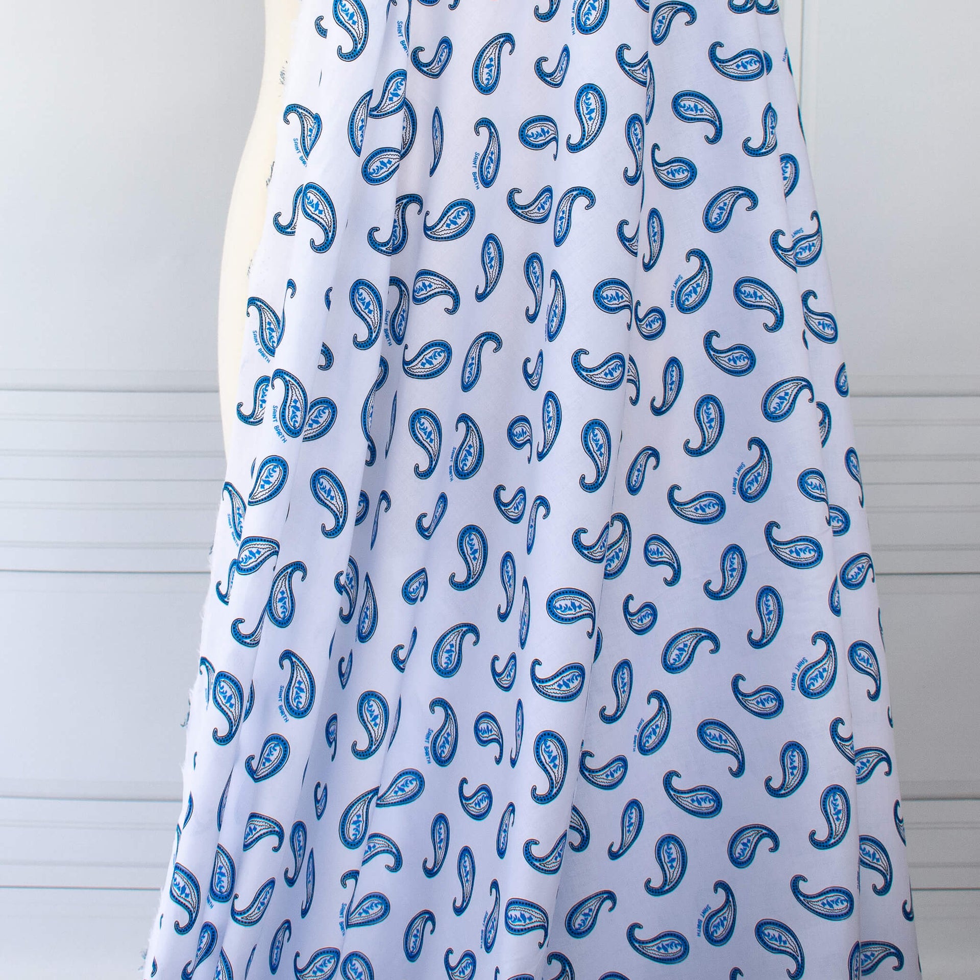 Image of Italian Blue and white paisley print cotton woven fabric drape.