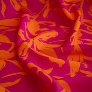A close-up of  Italian Viscose fabric by the yard in a tropical leaf print.