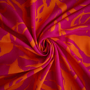 Image of Italian Viscose fabric by the yard in a tropical leaf print demonstrating fabric fullness.