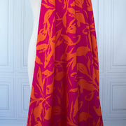  Italian Viscose fabric by the yard in a tropical leaf print draped on dress form.
