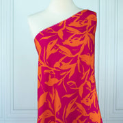  Italian Viscose fabric by the yard in a tropical leaf print draped on dress form.