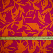 Image of Italian Viscose fabric by the yard in a tropical leaf print demonstrating print scale with ruler.