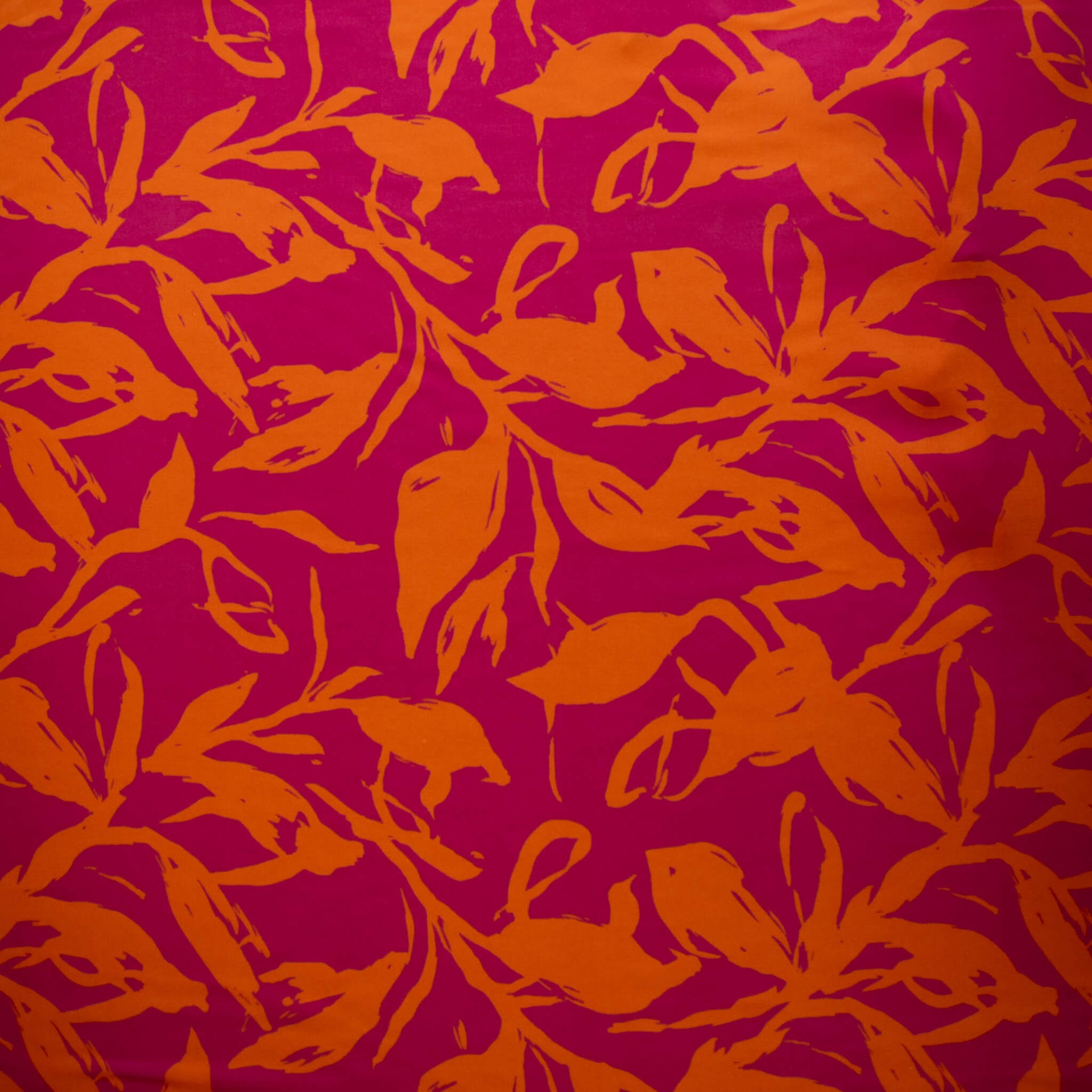 Image of Italian Viscose fabric by the yard in a tropical leaf print demonstrating print scale.
