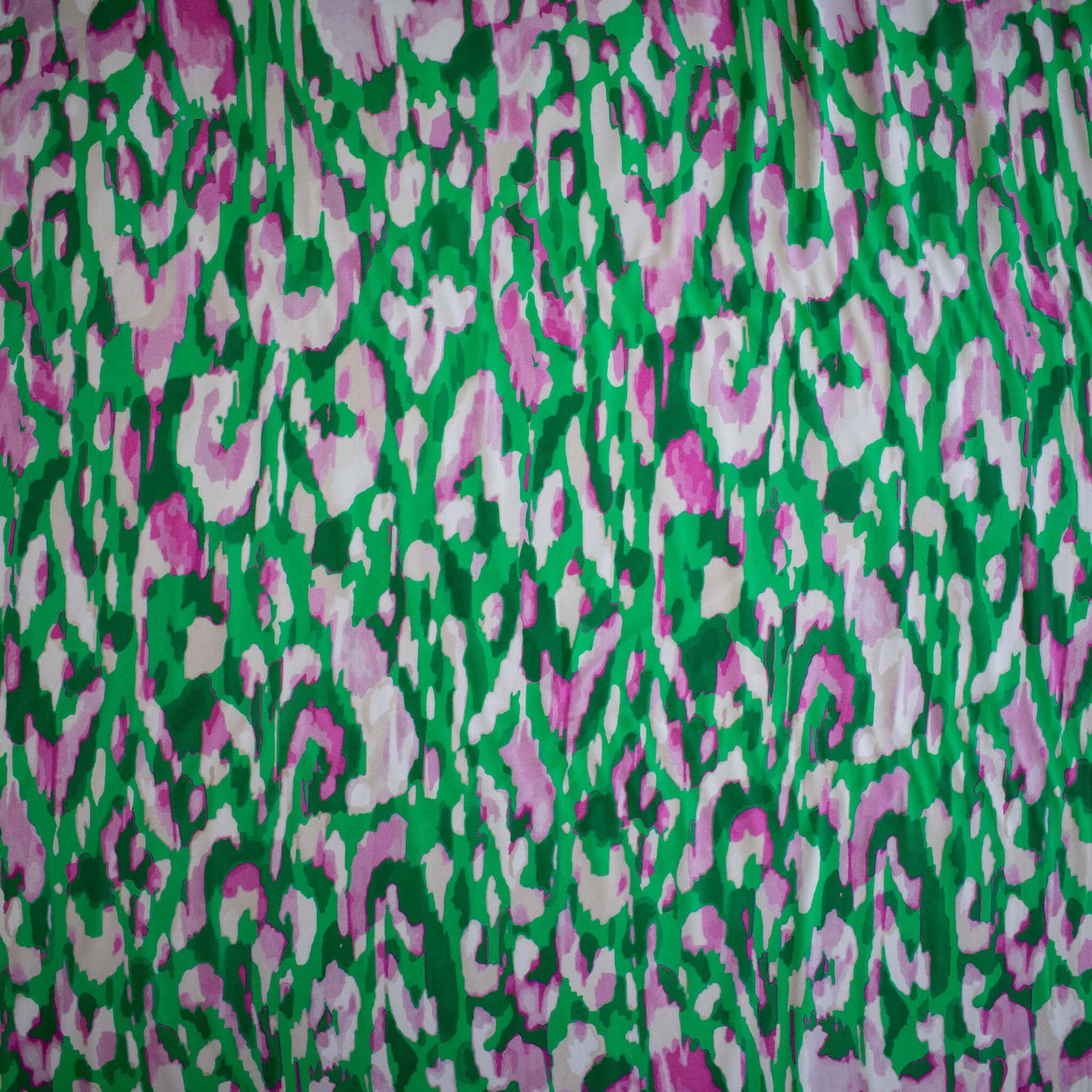 A close-up of Italian Viscose Woven Abstract Print fabric showing print.