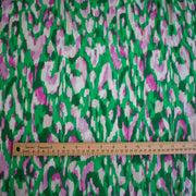 A close-up of Italian Viscose Woven Abstract Print fabric with ruler placed along the bottom edge for scale.