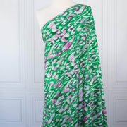 Image of Italian Viscose Woven Abstract Print fabric draped on dress form.