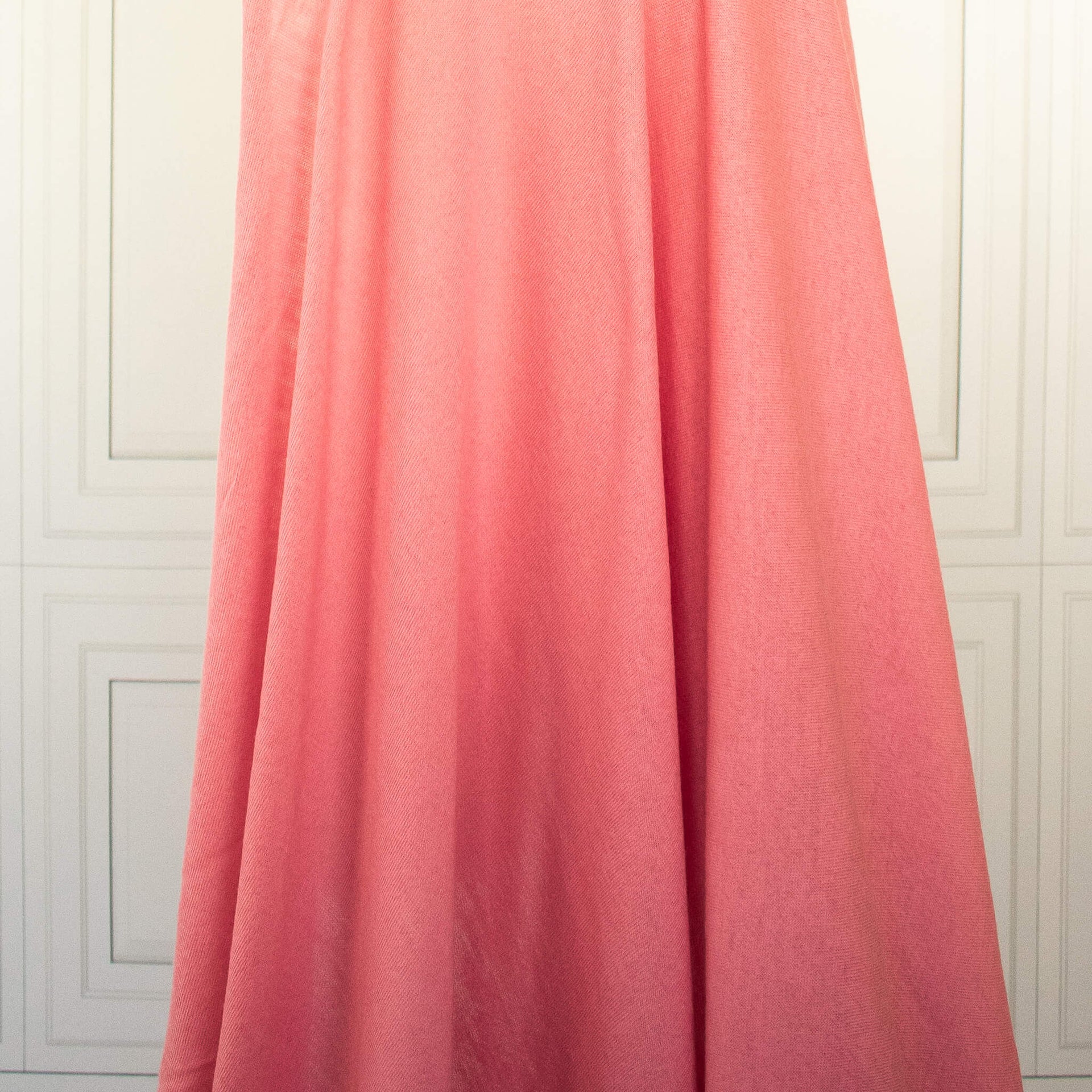 Image of Fine Italian Wool Jersey knit fabric in Pink Blush draped on dress form to show fabric drape.