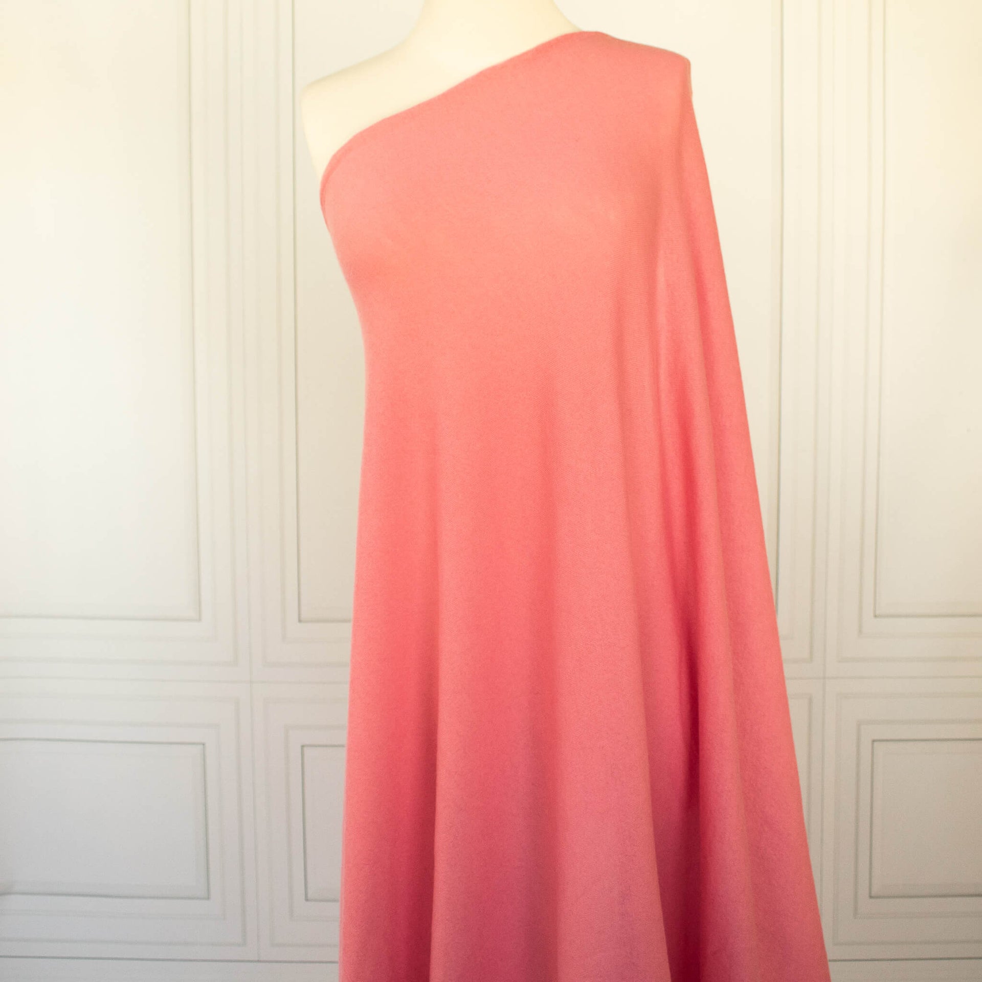 Image of Fine Italian Wool Jersey knit fabric in Pink Blush draped on dress form.