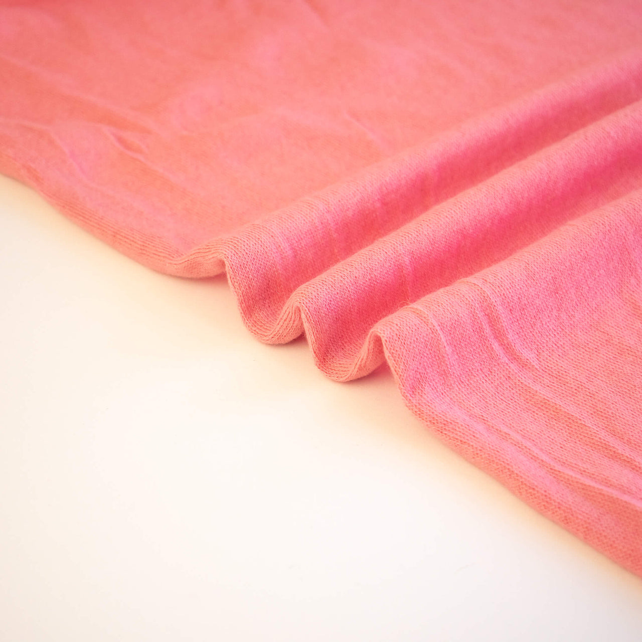 Image of Fine Italian Wool Jersey knit fabric selvedge in Pink Blush.