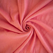 Image of Fine Italian Wool Jersey knit fabric in Pink Blush swirled  to show fabric fullness