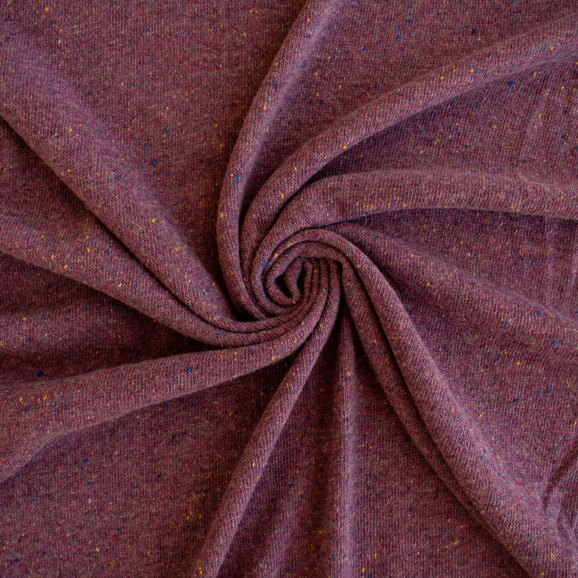 Image of Fine Italian Wool/Silk Blend Knit fabric by the yard in a heathered Violet Iris color-way swirled to show fabric fullness.