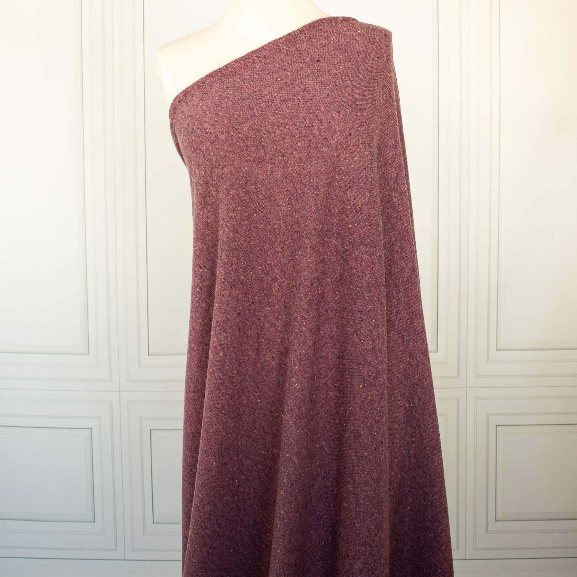 Image of Fine Italian Wool/Silk Blend Knit fabric draped on dress form.