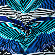 Italian Abstract knit fabric by the yard. The soft hand and gorgeous drape is comfortable and stylish. Be your own designer and create something uniquely your own by taking advantage of the figure flattering print design! Image of fabric fullness.