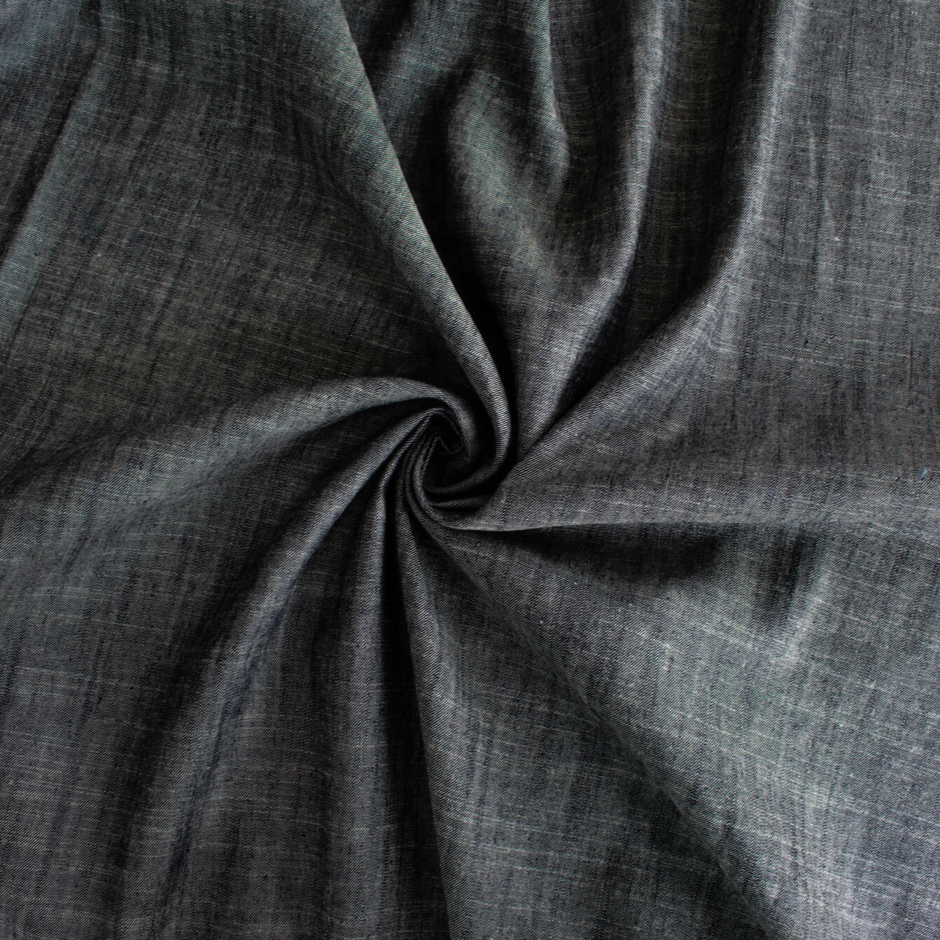  Stay cool and look amazing while you enjoy the breathability and sustainability of Tencel and all you love about linen in one gorgeous dark indigo fabric.&nbsp;  On the lighter side of a mid-weight with a beautiful sheen, nice drape, and softly textured hand you'll look 'Tres Chic'!  Image of fabric fullness.