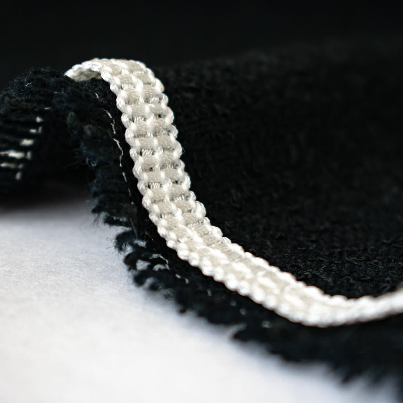 Mokubba Ivory Passenmenterie in soft white close up. Perfect trim to add a couture touch.