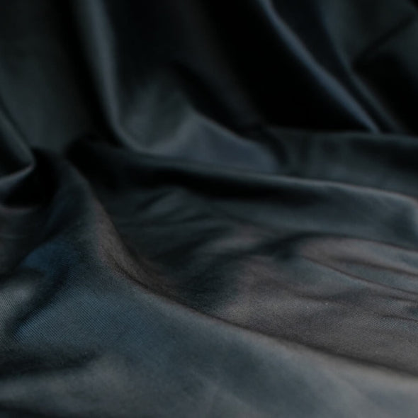 Take you wardrobe to the next level with our Black Lambskin stretch leather. Popular with designers, it is perfect for those looking for a sophisticated and exclusive look.  Indulge yourself in its soft and supple texture, with just the right amount of stretch for exceptional comfort. Close up image.