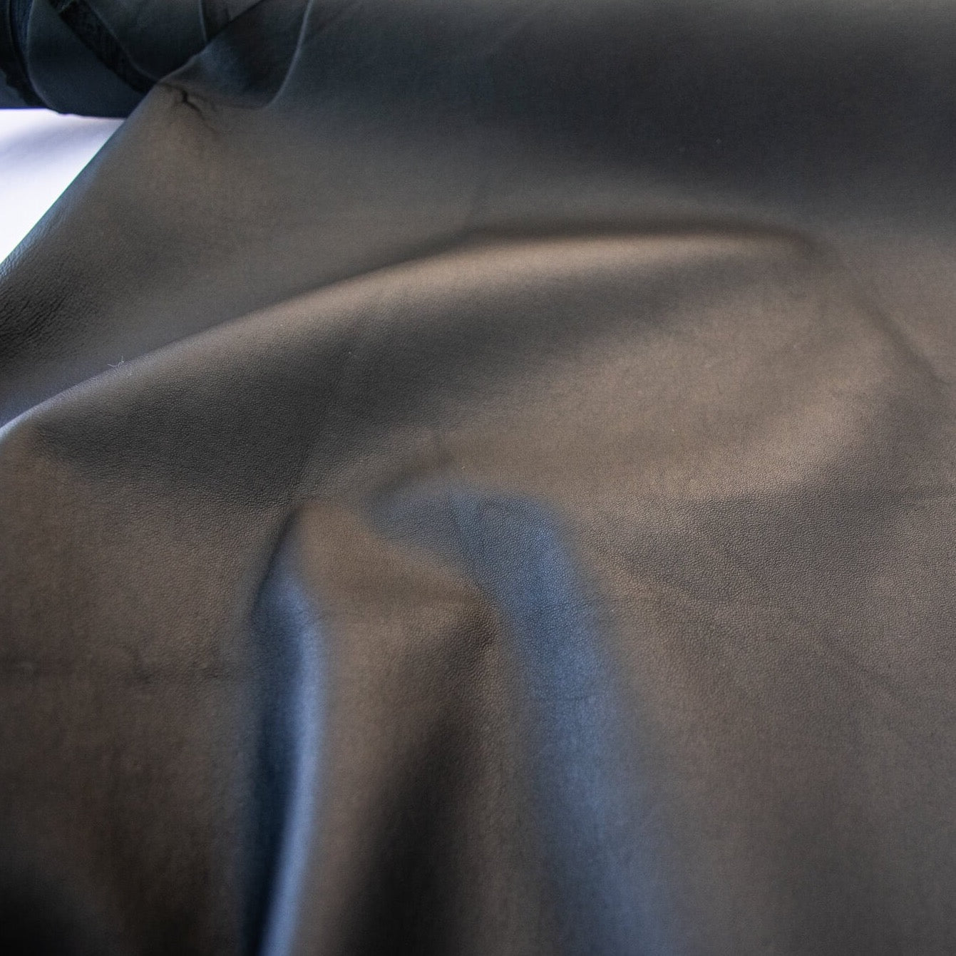 Take you wardrobe to the next level with our Black Lambskin stretch leather. Popular with designers, it is perfect for those looking for a sophisticated and exclusive look.  Indulge yourself in its soft and supple texture, with just the right amount of stretch for exceptional comfort. Image of leather texture.